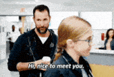 a man with a stethoscope around his neck is talking to a woman in a hospital and says hi nice to meet you