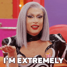 a drag queen says i 'm extremely in a black and white dress