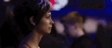 a close up of a woman 's face with the words `` run-ron '' written on the bottom of the image .