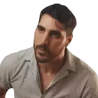 a man with a beard wearing a striped shirt looks to his left