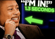 a man in a suit and tie is smiling in front of a sign that says " i 'm in 1.3 seconds "