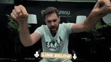 a man in a white t-shirt with a picture of evolution on it