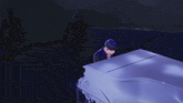 a man playing a piano in a dark room with a microphone