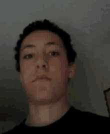 a man is making a funny face with his mouth open .