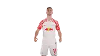 a soccer player wearing a red bull shirt and shorts
