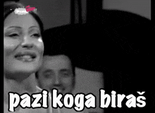 a black and white photo of a woman with the words pazi koga biras on the bottom
