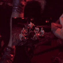 a group of men sitting around a table with a man sitting on top