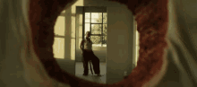 Dancing Hole In The Wall GIF - Dancing Hole In The Wall Through The Hole GIFs