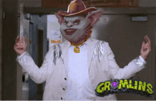 a picture of a man with a cowboy hat and a necklace that says ' gremlins '
