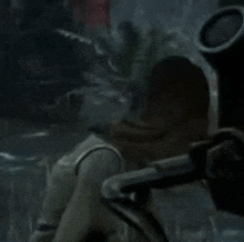 a person is playing a video game with a sniper rifle in the foreground and a red cross in the middle