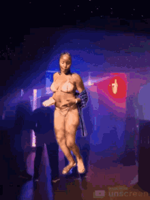 a woman in a bikini is dancing in a night club