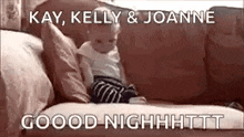 a baby is sitting on a couch with a caption that says `` kay , kelly and joanne good night '' .