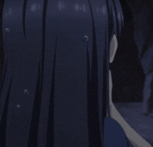 a close up of a girl with long dark hair