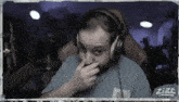 a man wearing headphones and a shirt that says ' zzt ' on the bottom