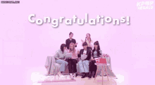 a group of women sitting on a couch with the words congratulations written on the top