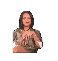 a woman in a very plunging top is pointing at something