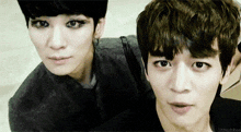 two young men are posing for a picture with the caption littleshinee on the bottom right