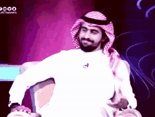 a man with a beard is sitting in front of a screen that says jdchannels on it
