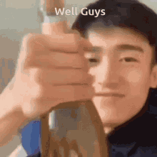 a close up of a man 's face with the words well guys above him