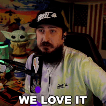 a man with a beard wears a hat that says ghost on it