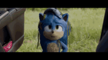 a close up of a sonic the hedgehog holding a fish on his head