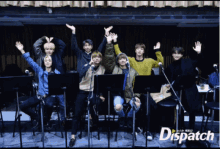 a group of people are standing in front of microphones and a dispatch logo