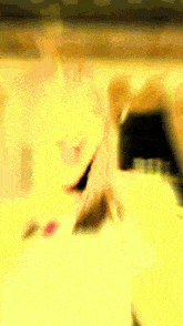 a blurry picture of a person 's face in a yellow background