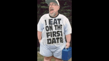 a man wears a shirt that says i eat on the first date