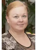 a woman with red hair is wearing a lace top and earrings