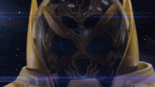 a close up of a robot 's face with a blue light coming out of it 's eyes