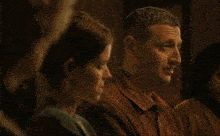 a man and woman are sitting next to each other with the words im orgasming fine below them