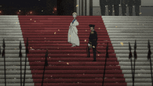 a man and woman standing on a set of stairs