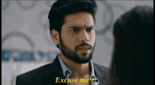 a man with a beard says " excuse me "