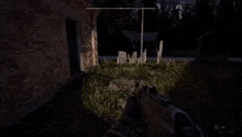 a person is playing a video game with a sniper rifle in a dark room .