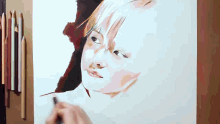 a drawing of a child 's face is being completed