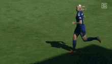 a female soccer player with the number 5 on her jersey