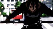 a man in a black shirt is holding a sword in his right hand