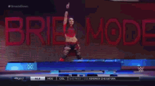 a brie bella wrestler is on a stage