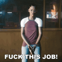 a woman holding a gun with the words " fuck this job " behind her