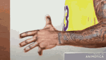 a man with a tattoo on his arm is wearing a yellow jersey with the number 3