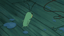 a cartoon character standing on a wooden floor
