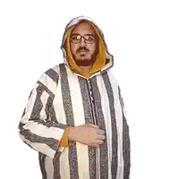 a man with a beard wearing a striped jacket and a hood