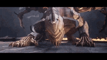 a monster with sharp claws and horns is crawling on the ground