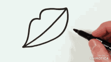 a person is drawing a leaf with a marker that says made in animatica on the bottom