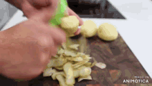 a person is peeling potatoes on a wooden cutting board made in animatica