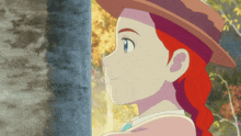 a girl with red hair is wearing a hat and smiling