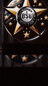 a man is standing in front of a billiard star ball emblem
