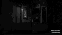 a black and white photo of a house at night with the words twin peaks showtime on the bottom