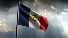 a french flag is waving in the wind