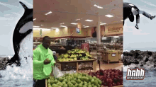 a man in a neon green hoodie is standing in front of a bakery section of a grocery store